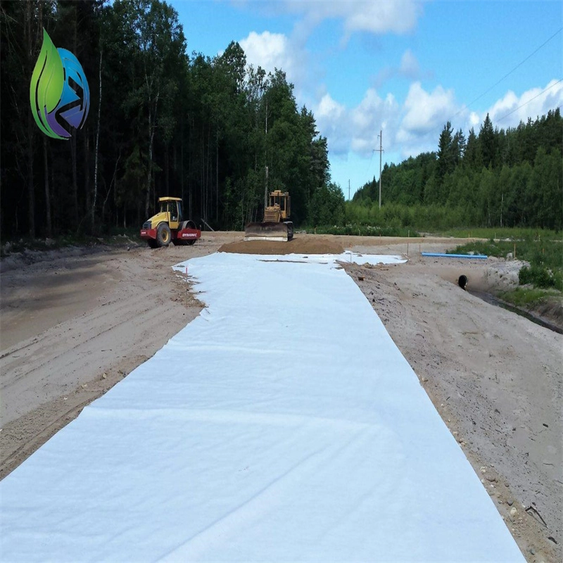 Geotextile being laid on a prepared subgrade